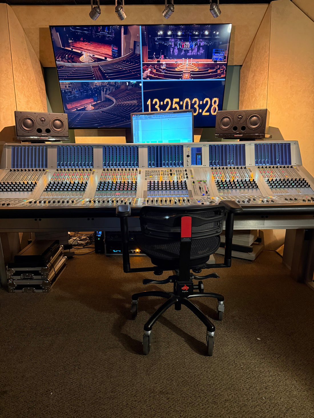 Stealth chair at a large mixing console in a recording studio
